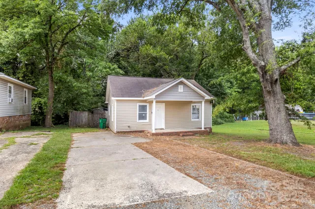 a front view of a house with yard