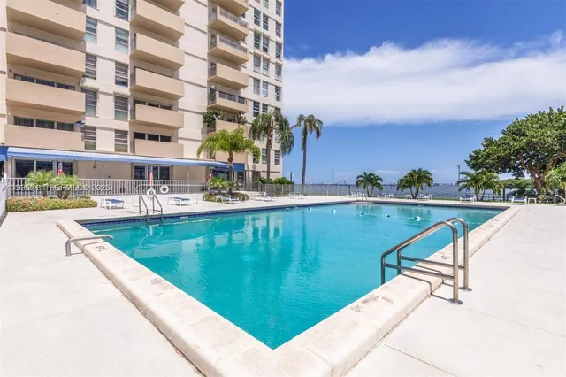 a view of swimming pool with a yard