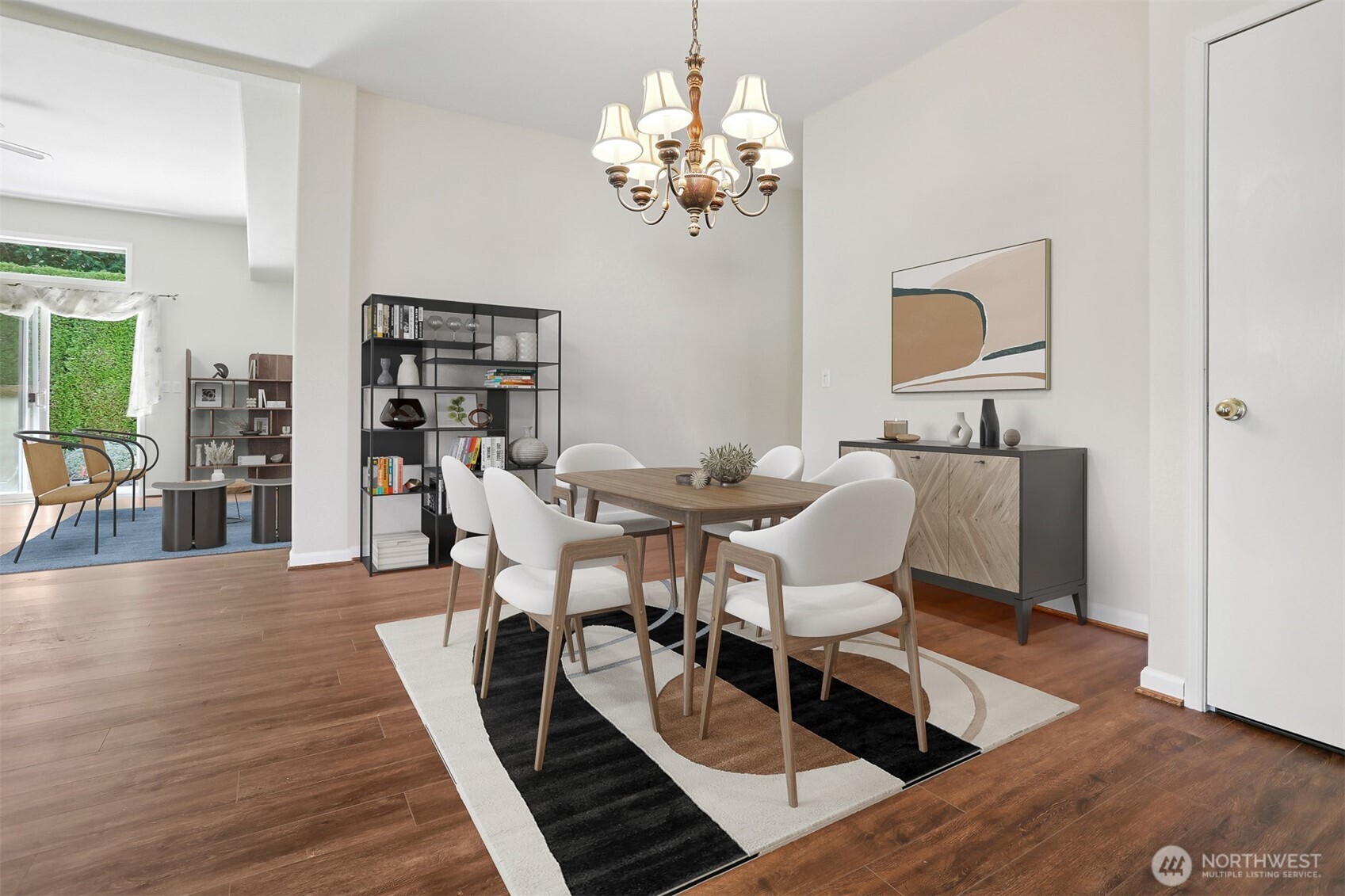 23701 9th Place West Bothell, WA 98021 - Photo 11 of 40 a dining room with wooden floor a chandelier a glass table and chairs