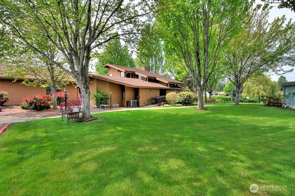 23701 9th Place West Bothell, WA 98021 - Photo 34 of 40 a front view of a house with a garden and trees