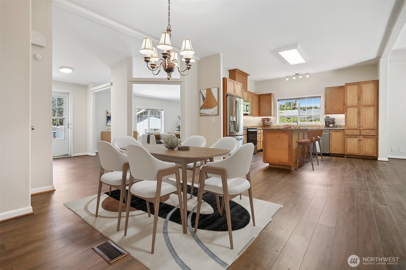 23701 9th Place West Bothell, WA 98021 - Photo 10 of 40 a view of a dining room with furniture wooden floor and chandelier