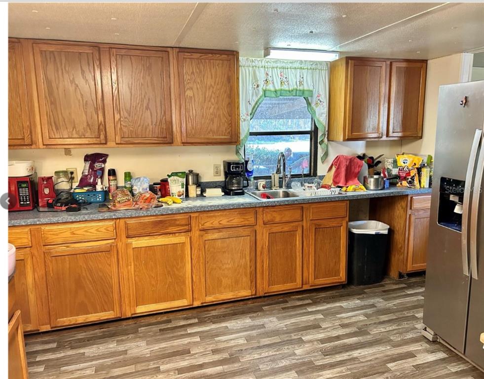 11475 167th Road Live Oak, FL 32060 - Photo 12 of 15 a kitchen with sink cabinets and window