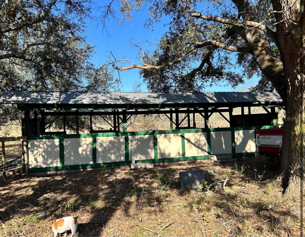 11475 167th Road Live Oak, FL 32060 - Photo 7 of 15 a view of a house with a yard