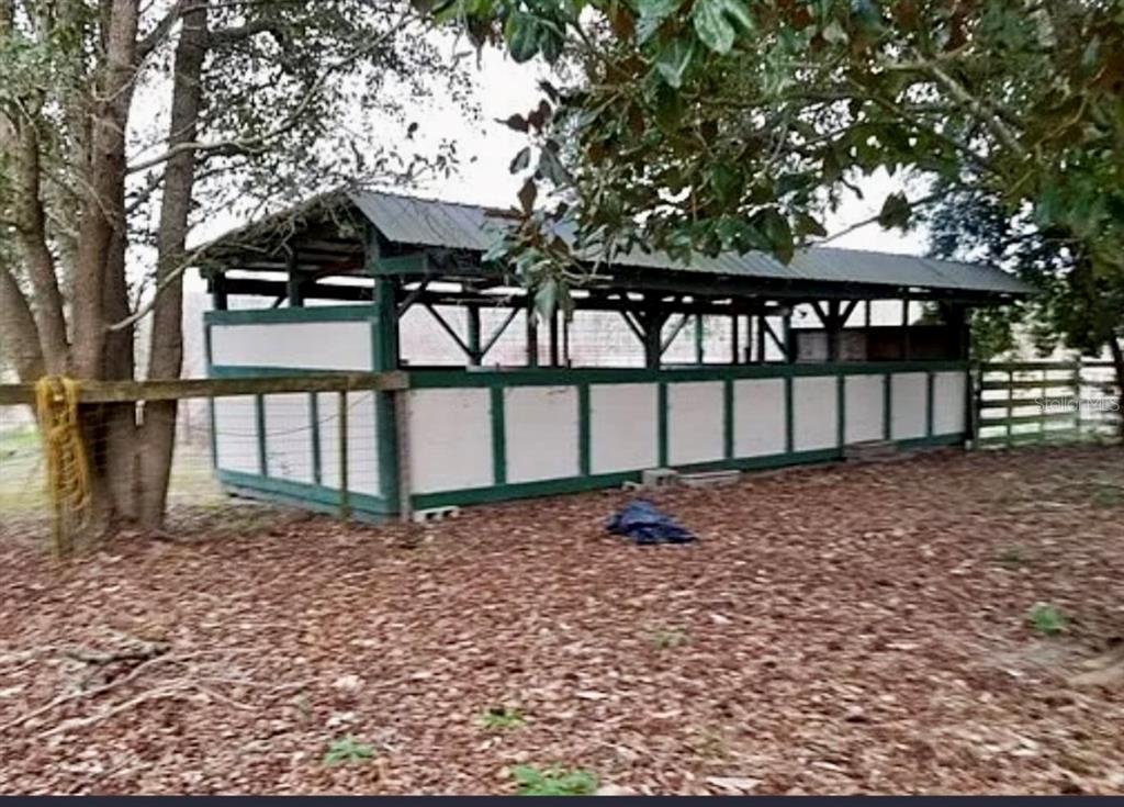 11475 167th Road Live Oak, FL 32060 - Photo 8 of 15 a front view of a house with a yard