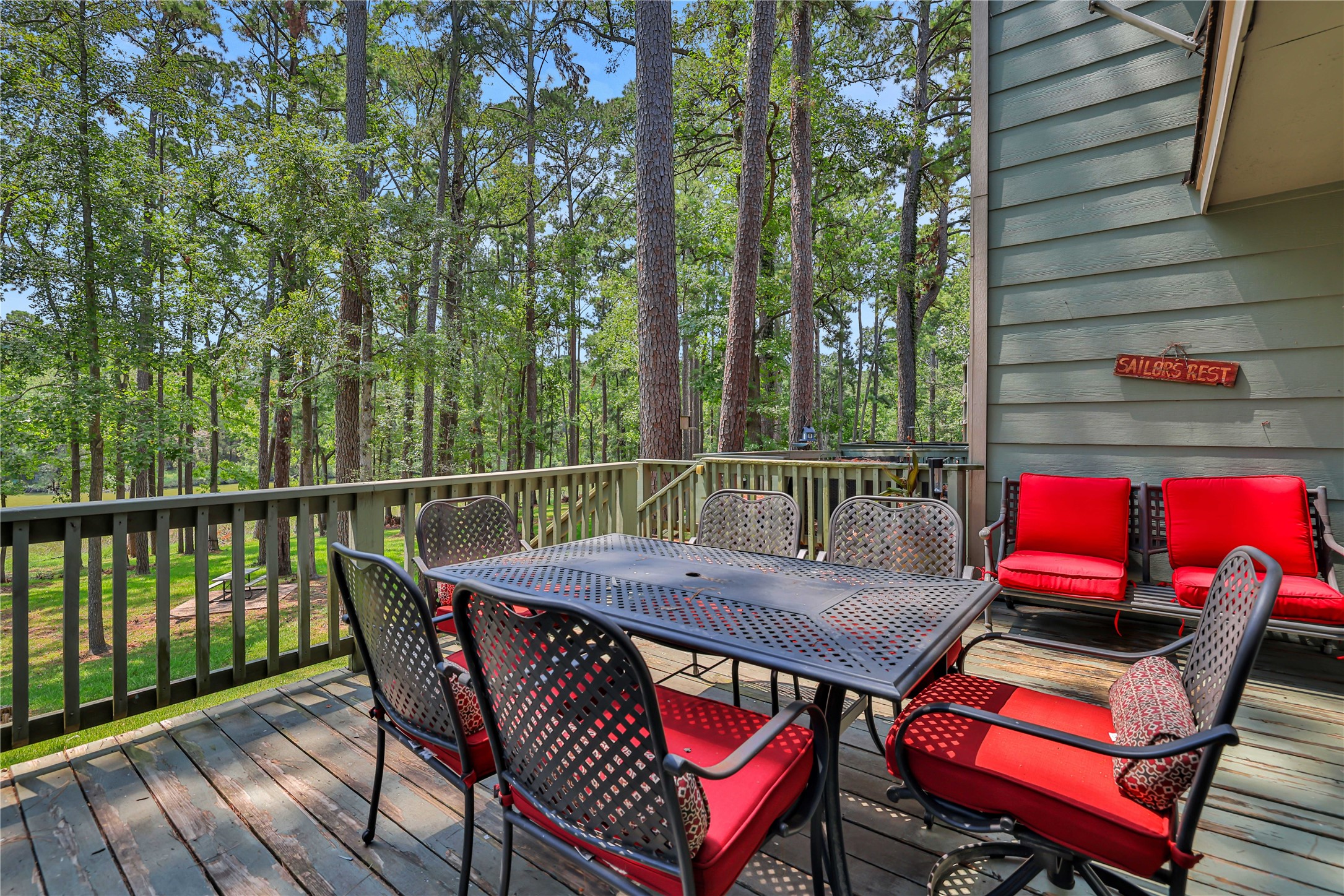 146 Villa Way Coldspring, TX 77331 - Photo 8 of 37 The back deck is a great spot for your morning coffee overlooking the marina inlet