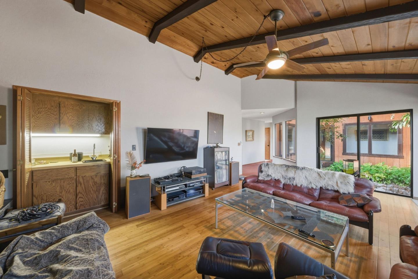 917 Holly Road Belmont, CA 94002 - Photo 22 of 82 a living room with furniture and a flat screen tv
