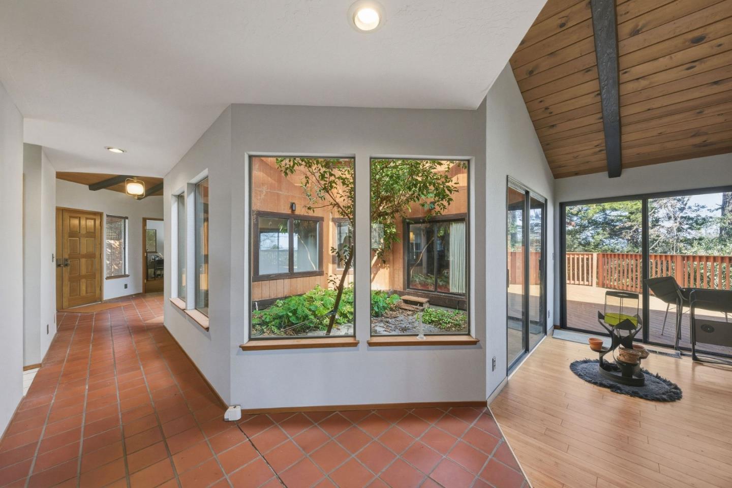 917 Holly Road Belmont, CA 94002 - Photo 23 of 82 a room with furniture and a large window