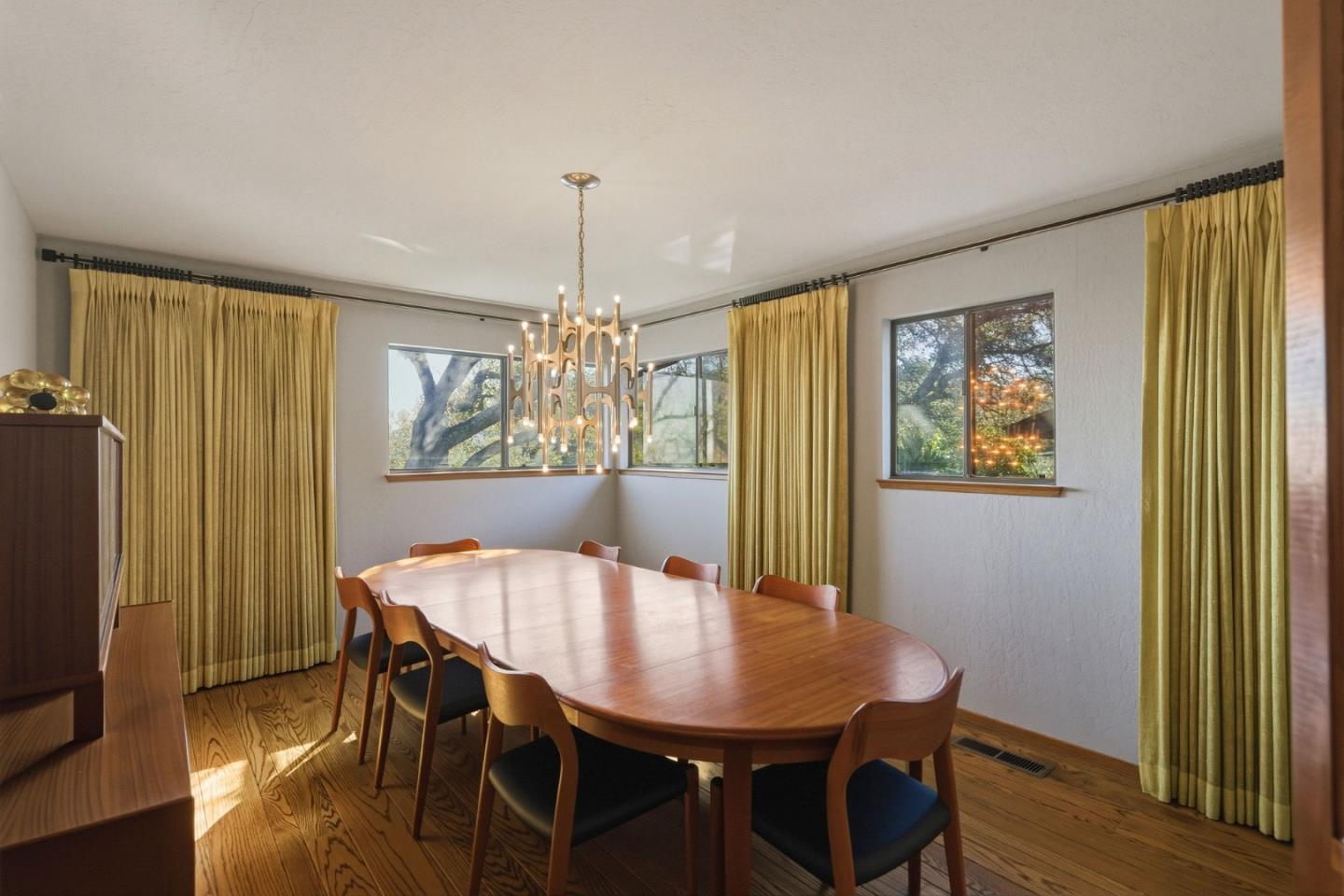 917 Holly Road Belmont, CA 94002 - Photo 25 of 82 a view of a dining room with furniture window and wooden floor