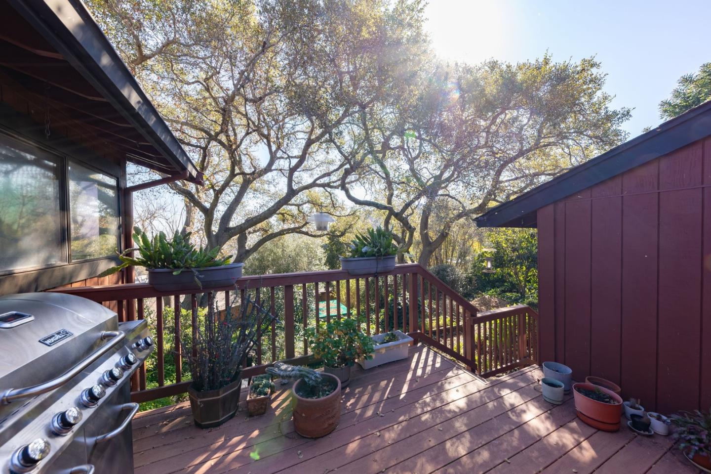 917 Holly Road Belmont, CA 94002 - Photo 35 of 82 a view of a roof deck with wooden floor and fence