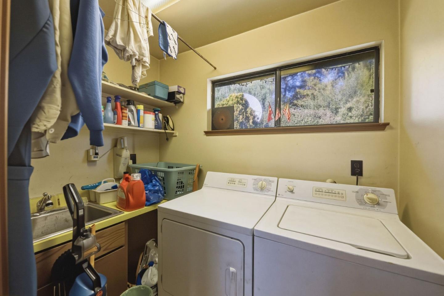 917 Holly Road Belmont, CA 94002 - Photo 47 of 82 a view of storage and utility room with washer and dryer