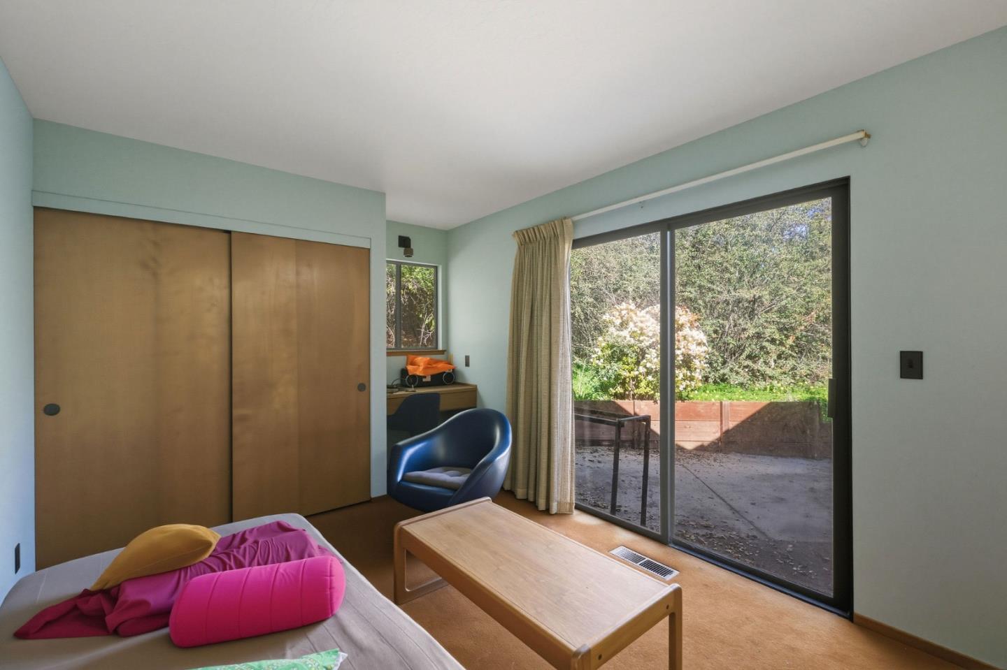 917 Holly Road Belmont, CA 94002 - Photo 60 of 82 a bedroom with furniture and a large window