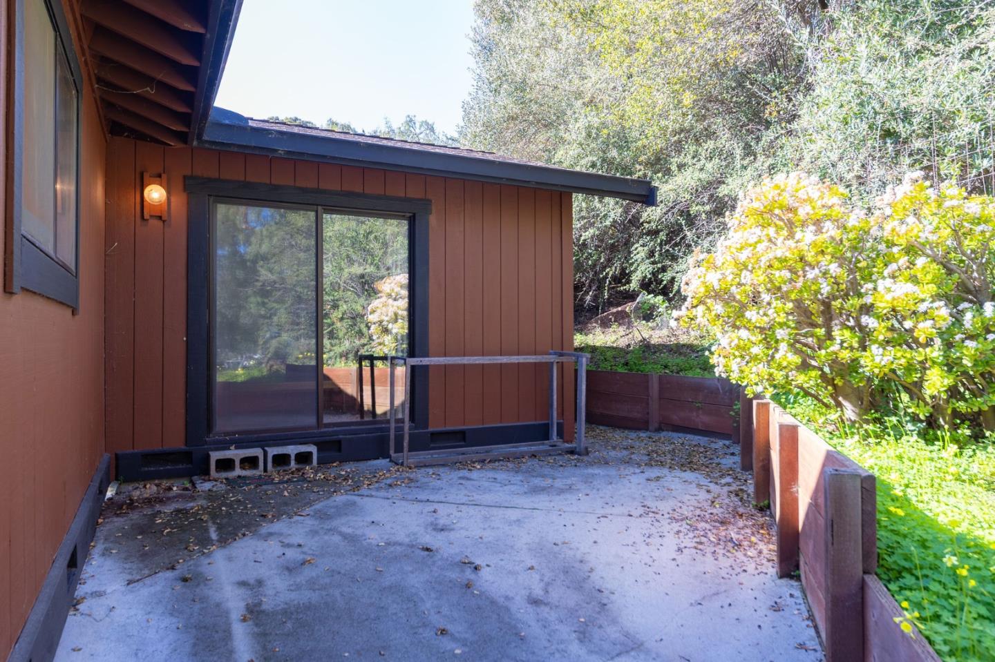 917 Holly Road Belmont, CA 94002 - Photo 61 of 82 a backyard of a house with large trees and wooden fence