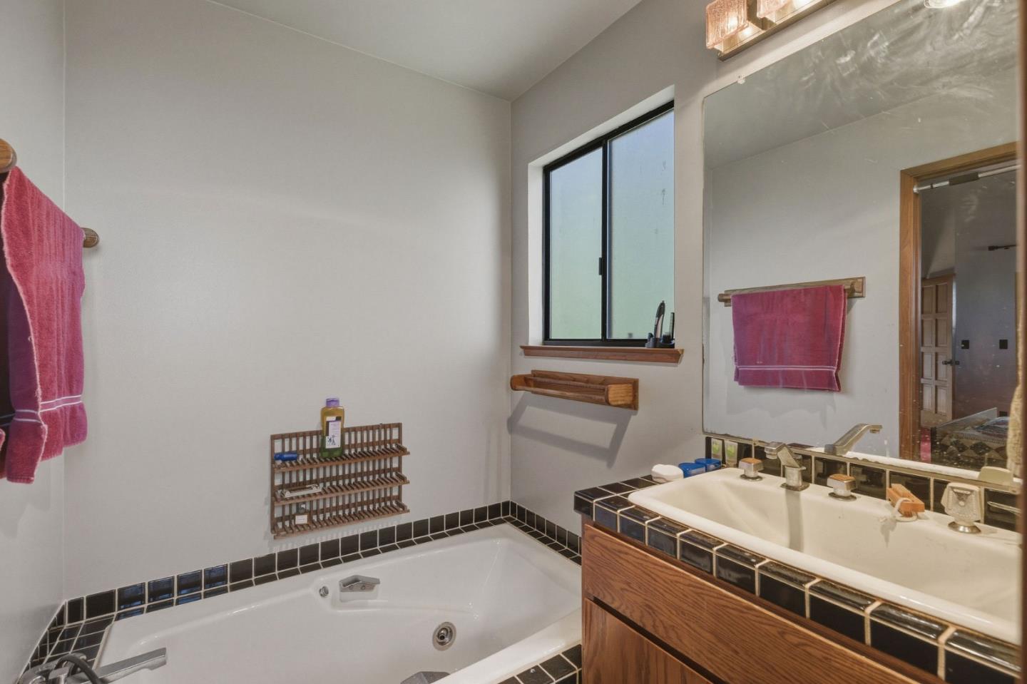 917 Holly Road Belmont, CA 94002 - Photo 71 of 82 a bathroom with a sink and a bathtub