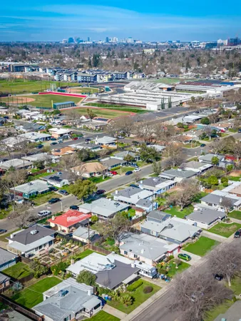 an aerial view of residential building and lake
