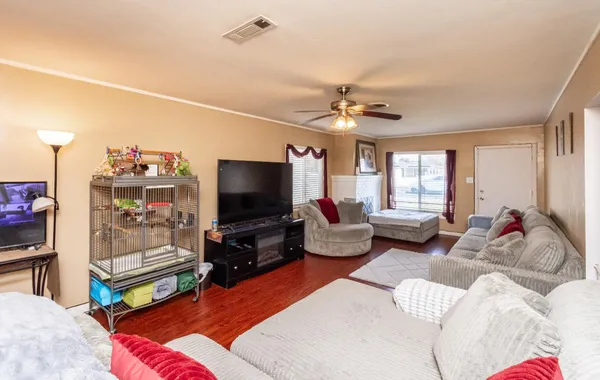 a living room with furniture and a flat screen tv
