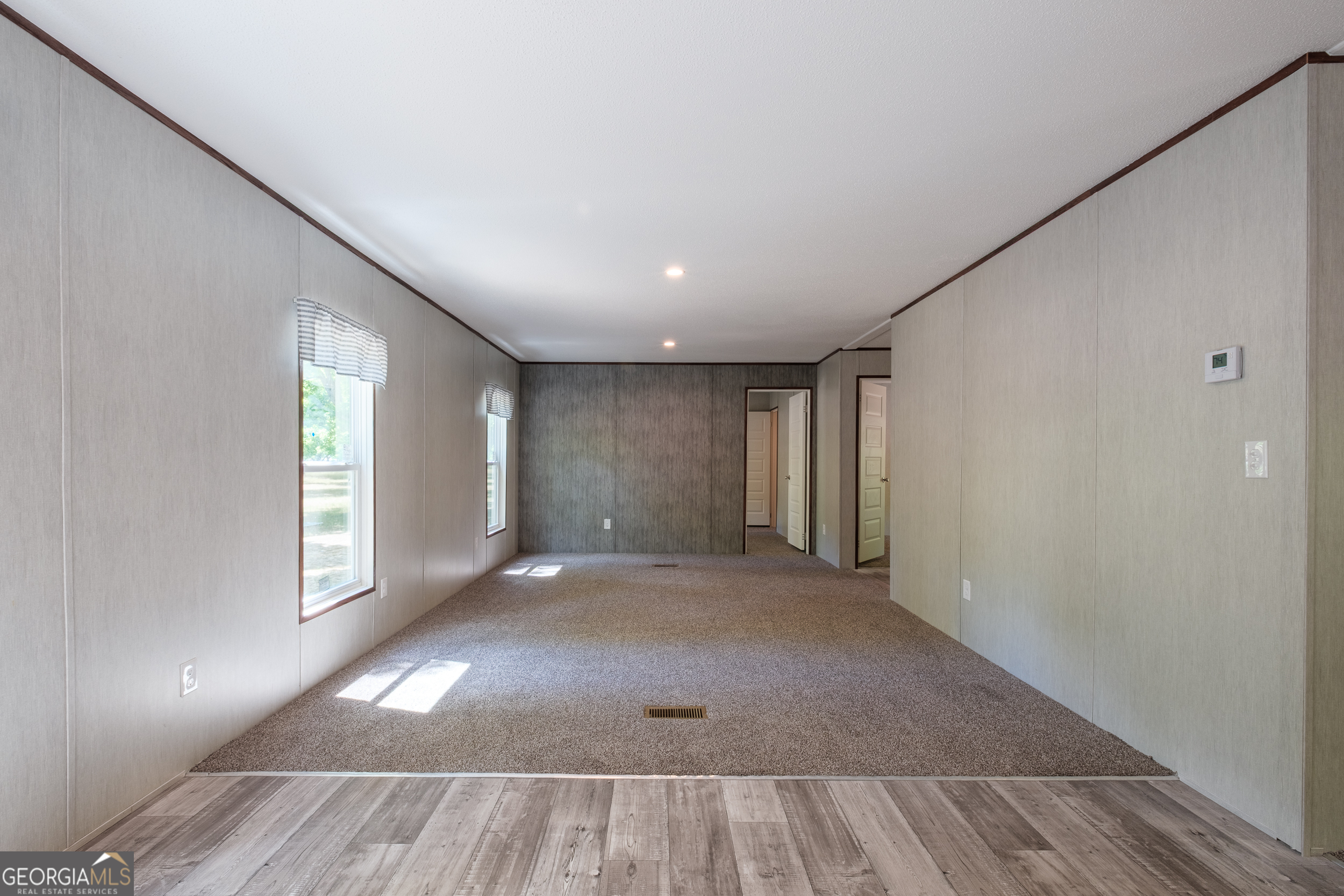 2853 Lake Lannell Road Odum, GA 31555 - Photo 16 of 29 an empty room with windows and closet