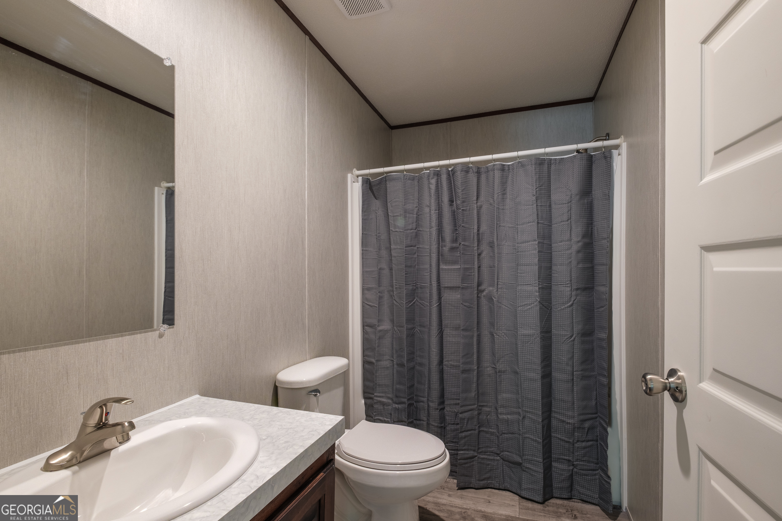 2853 Lake Lannell Road Odum, GA 31555 - Photo 20 of 29 a bathroom with a sink toilet and shower