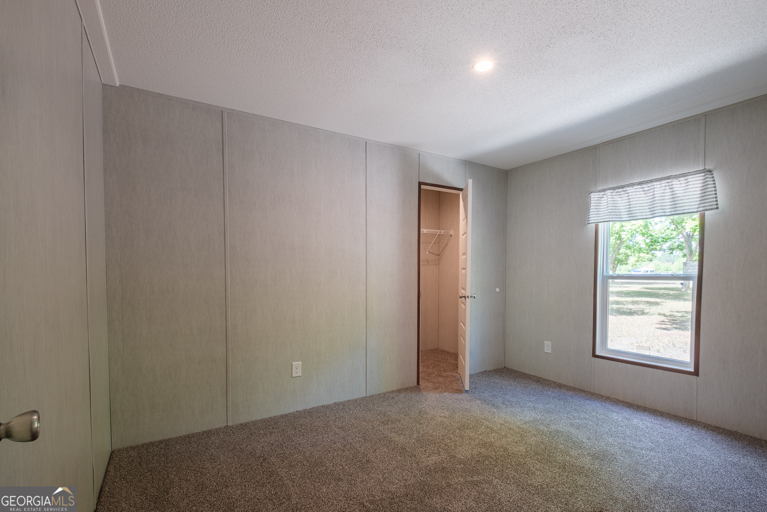 2853 Lake Lannell Road Odum, GA 31555 - Photo 21 of 29 an empty room with windows