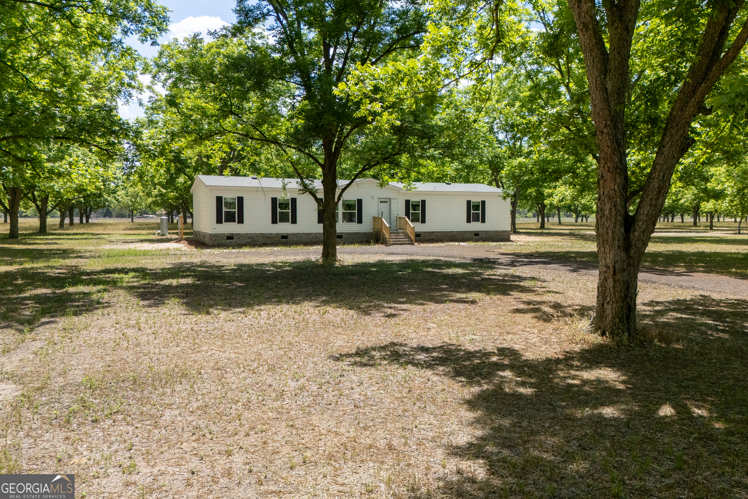 2853 Lake Lannell Road Odum, GA 31555 - Photo 4 of 29 a house that has a tree in front of the house