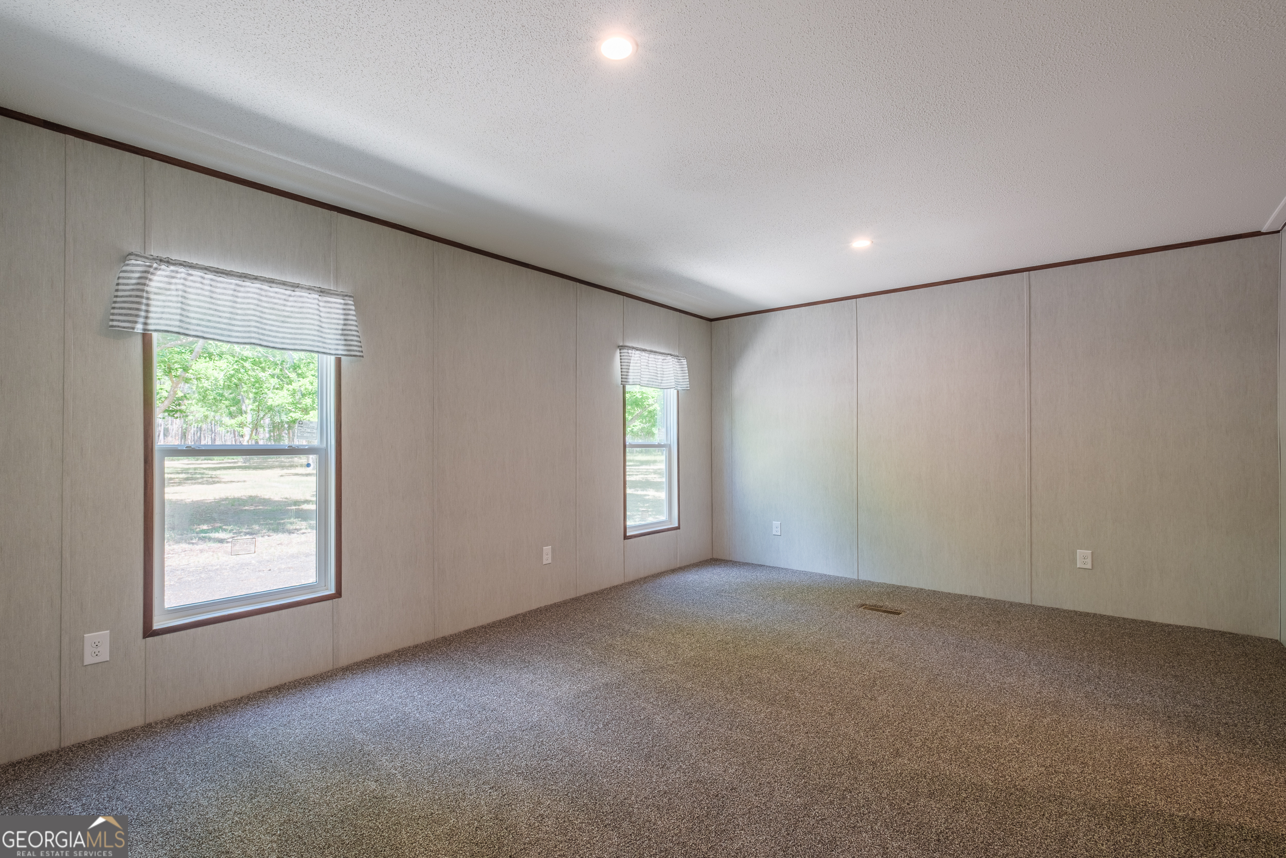 2853 Lake Lannell Road Odum, GA 31555 - Photo 7 of 29 an empty room with windows