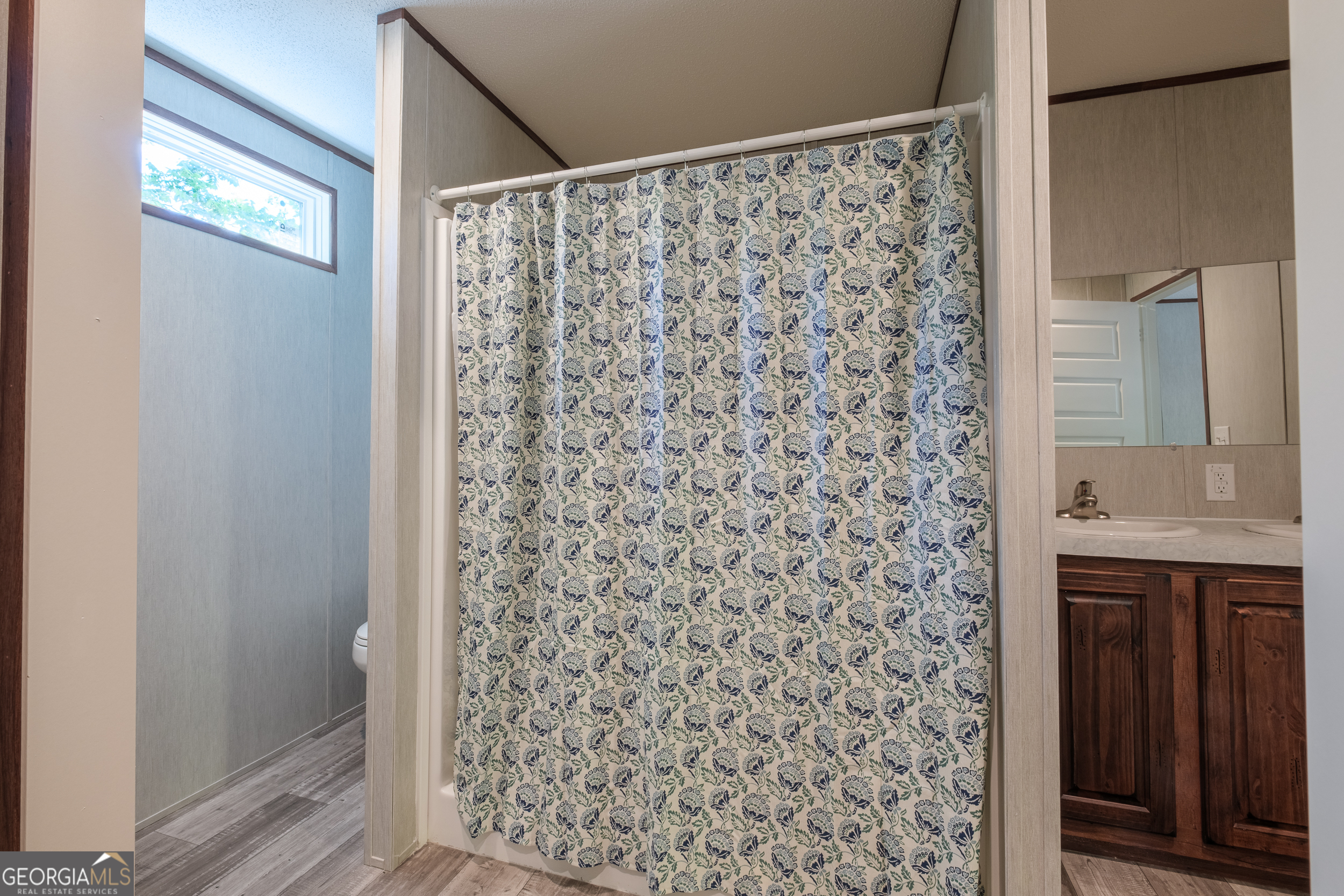 2853 Lake Lannell Road Odum, GA 31555 - Photo 10 of 29 a bathroom with a shower and a sink