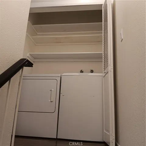 an entryway and a livingroom with furniture