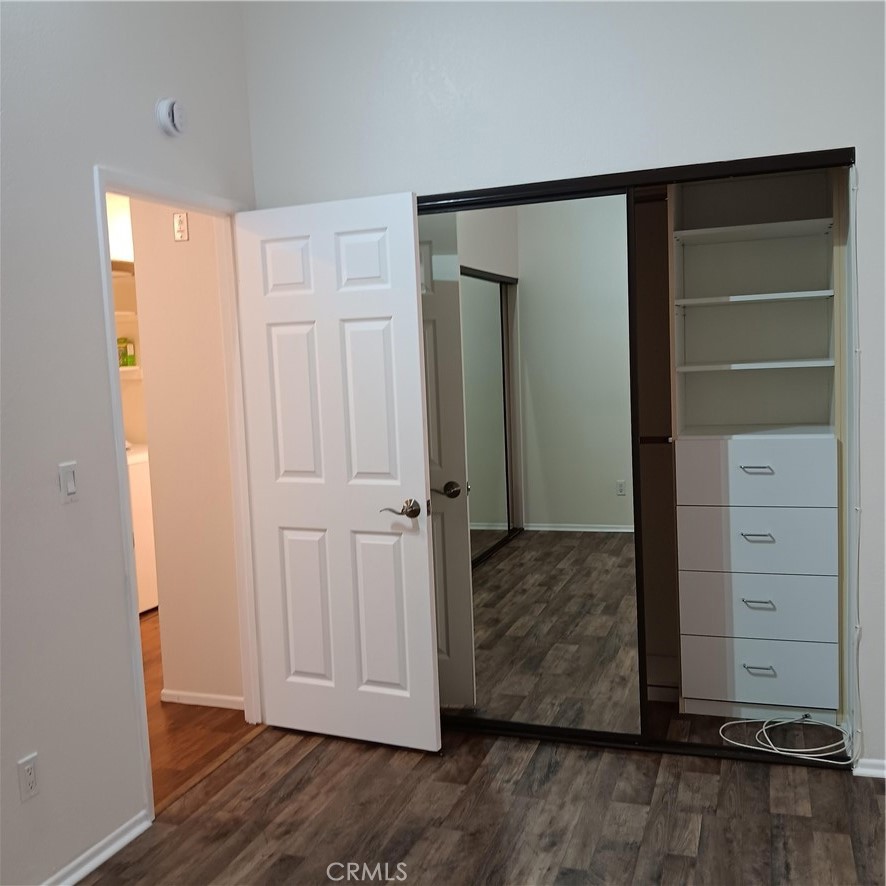 1419 West 179th Street, Unit 16 Gardena, CA 90248 - Photo 25 of 48 a view of walk in closet with wooden floor