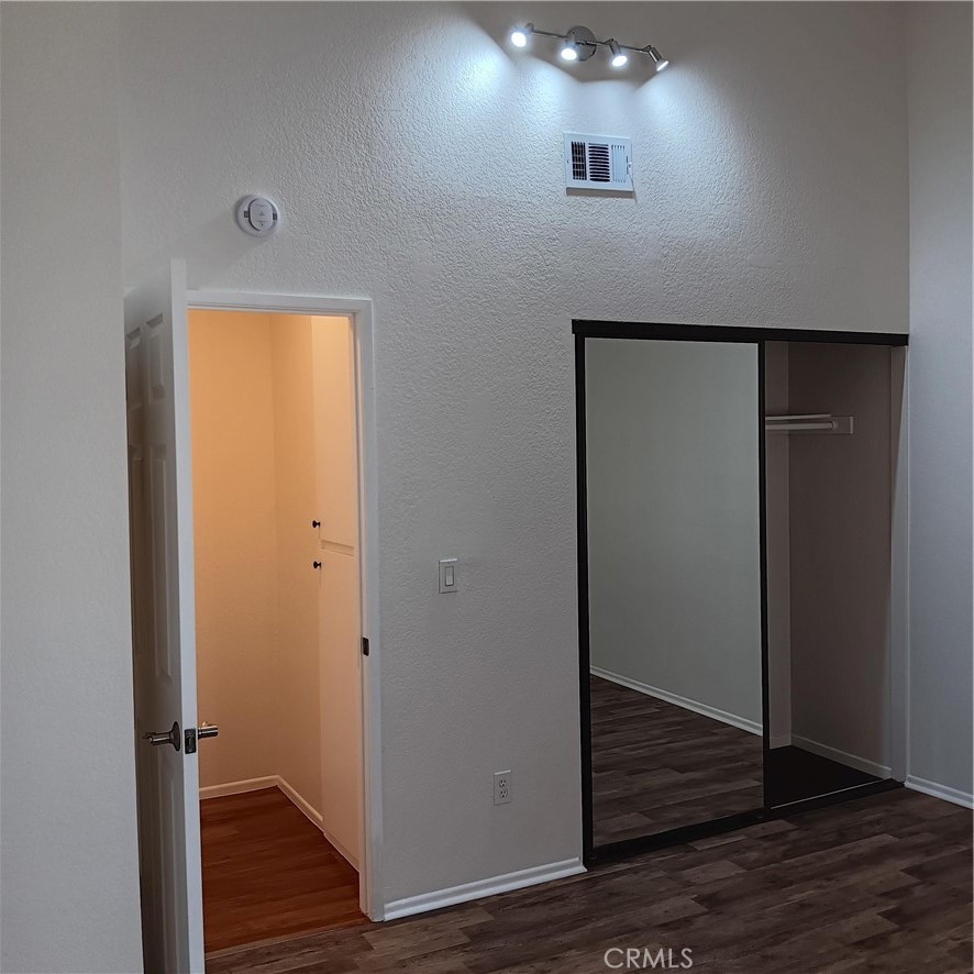 1419 West 179th Street, Unit 16 Gardena, CA 90248 - Photo 34 of 48 a view of a hallway with wooden floor