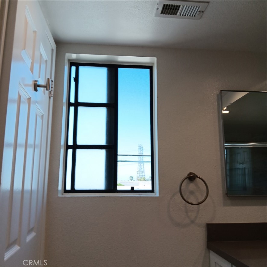 1419 West 179th Street, Unit 16 Gardena, CA 90248 - Photo 35 of 48 a view of small space with wooden floor and windows