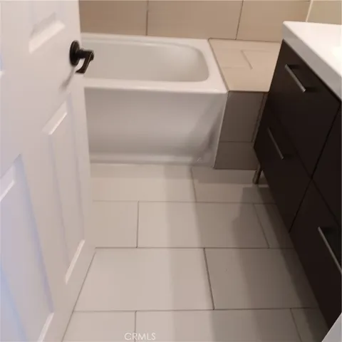 a white refrigerator freezer sitting in a kitchen