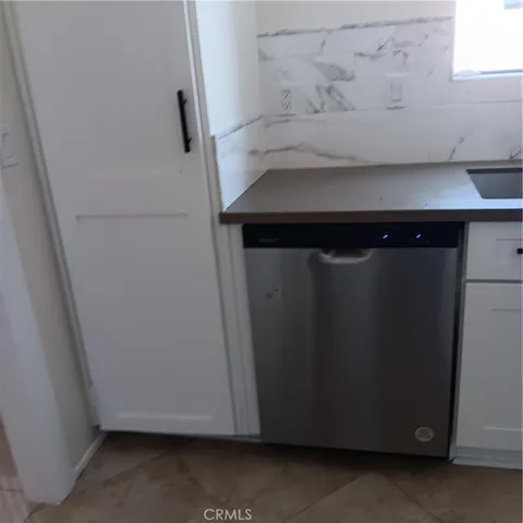 a bathroom with a sink and a window