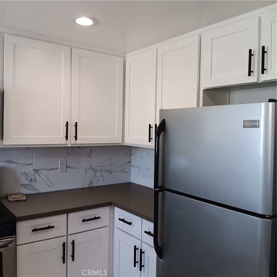 1419 West 179th Street, Unit 16 Gardena, CA 90248 - Photo 43 of 48 a white refrigerator freezer sitting in a kitchen
