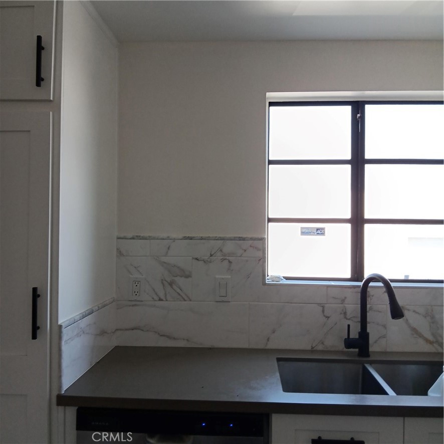 1419 West 179th Street, Unit 16 Gardena, CA 90248 - Photo 46 of 48 a bathroom with a sink and a window