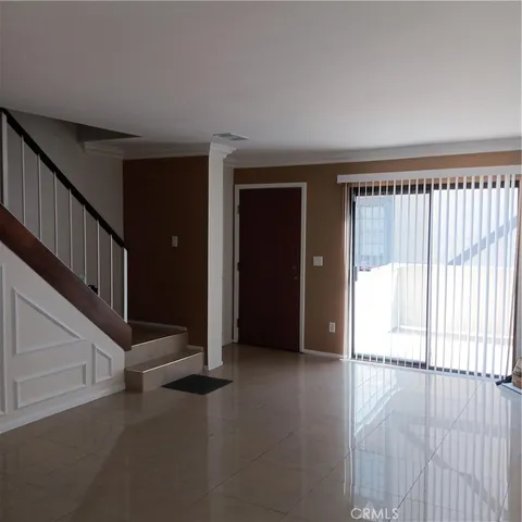a view of an empty room with stairs