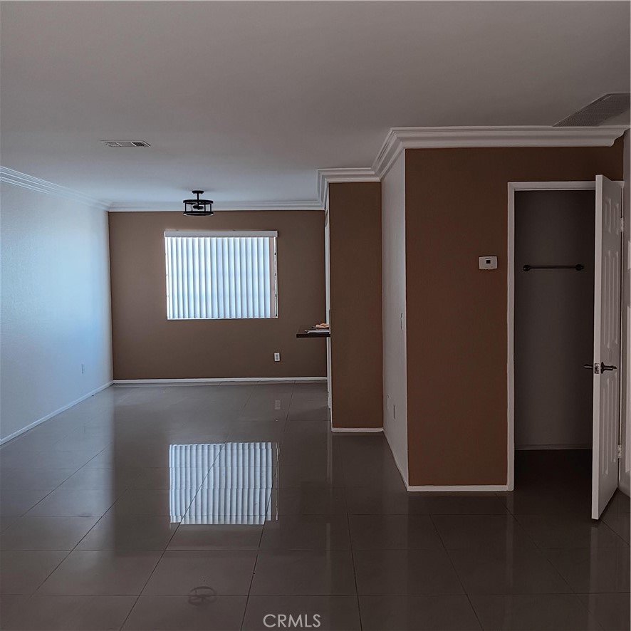 1419 West 179th Street, Unit 16 Gardena, CA 90248 - Photo 6 of 48 an empty room with wooden floor and windows