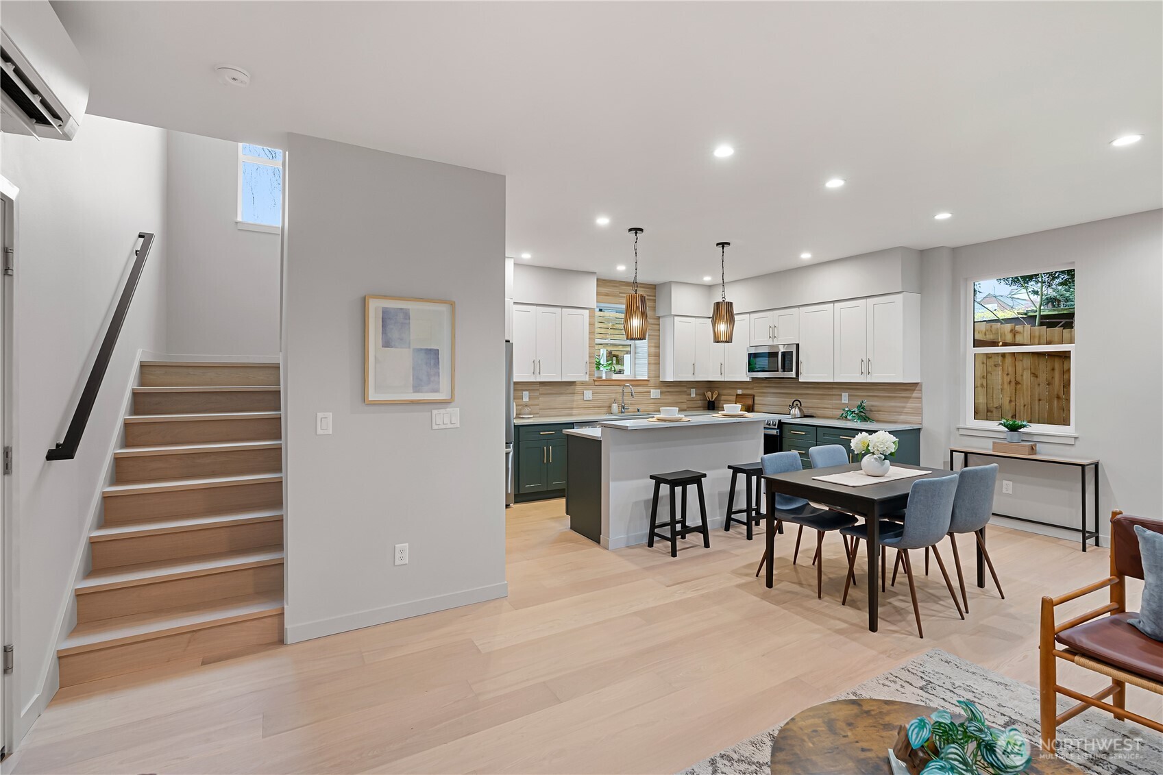 3412 Northwest 56th Street Seattle, WA 98107 - Photo 11 of 26 a open kitchen with a table and chairs in it