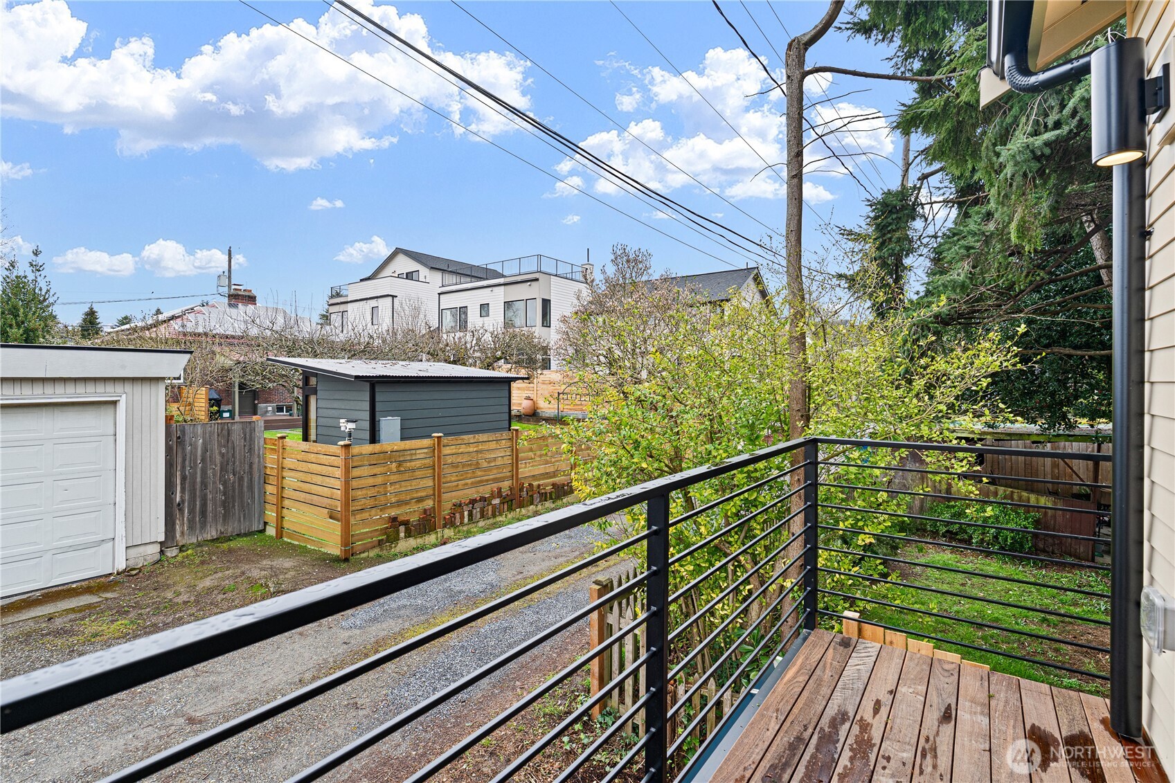 3412 Northwest 56th Street Seattle, WA 98107 - Photo 13 of 26 a view of a balcony with wooden floor and fence