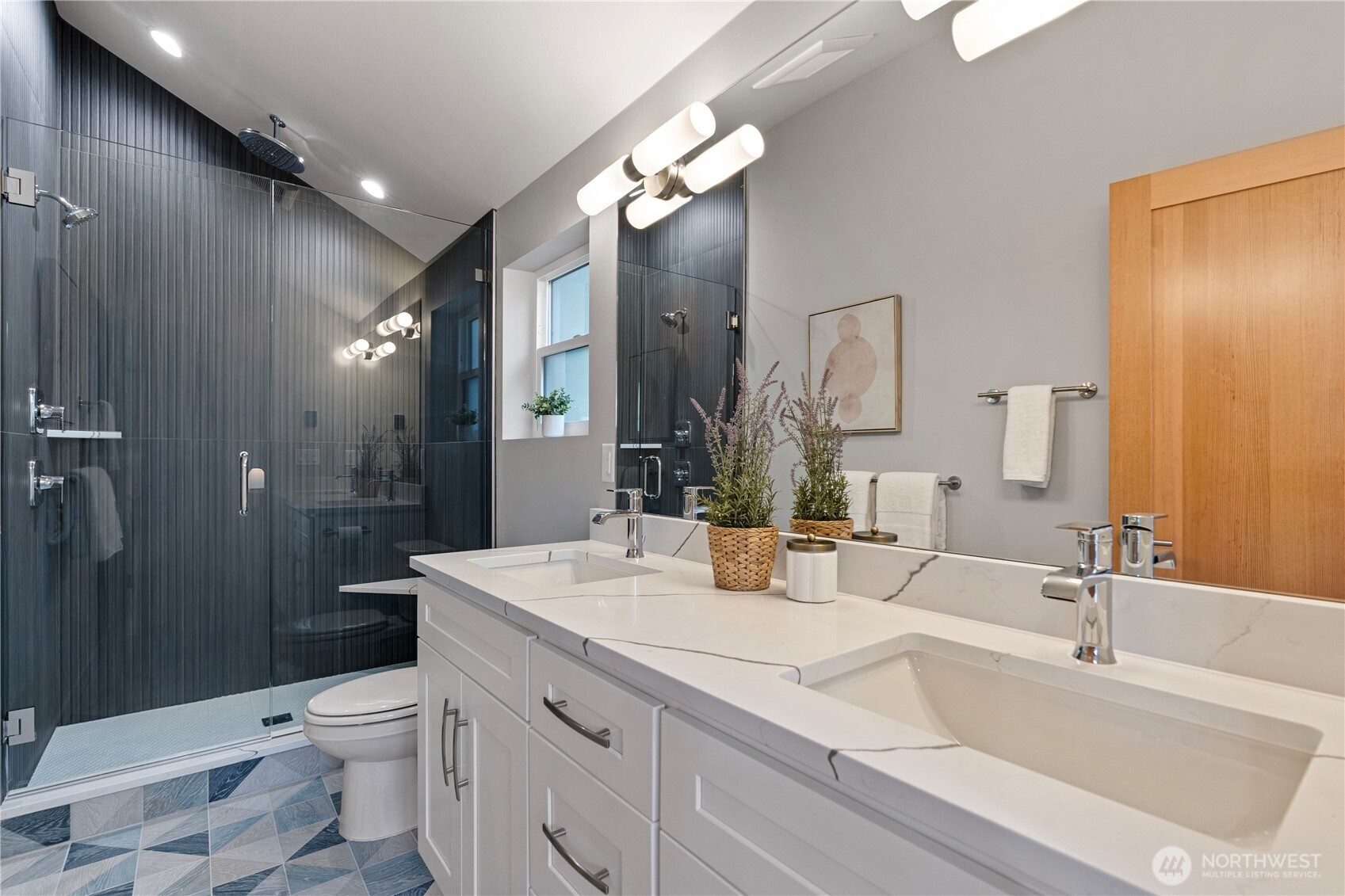 3412 Northwest 56th Street Seattle, WA 98107 - Photo 19 of 26 a bathroom with a double vanity sink toilet and shower
