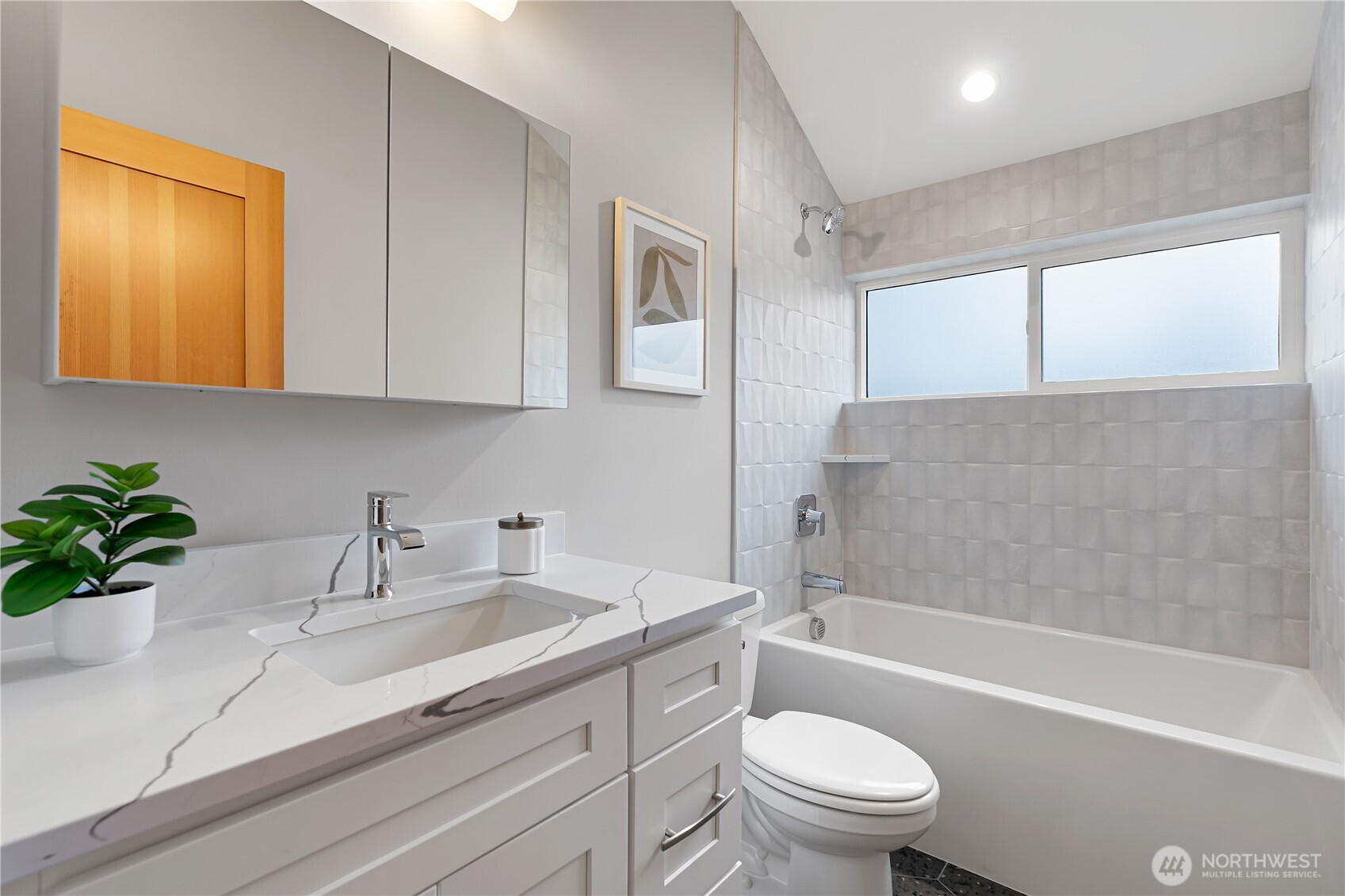 3412 Northwest 56th Street Seattle, WA 98107 - Photo 23 of 26 a bathroom with a sink a toilet and a bathtub