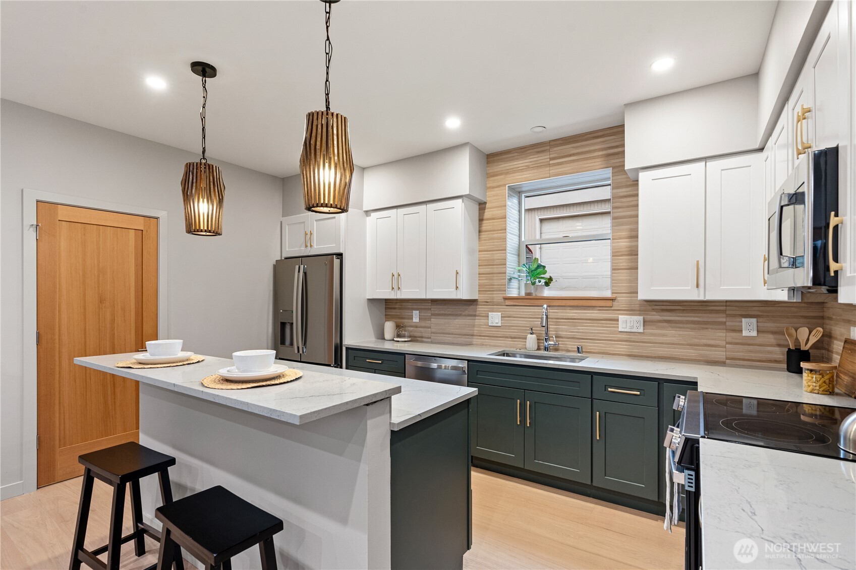 3412 Northwest 56th Street Seattle, WA 98107 - Photo 7 of 26 a kitchen with a sink cabinets and wooden floor