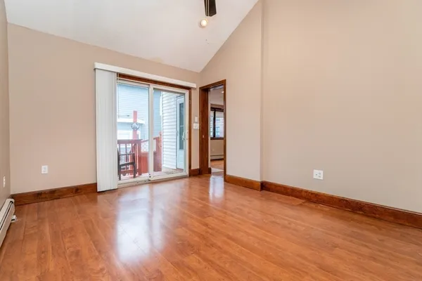 a bedroom with a bed and a mirror