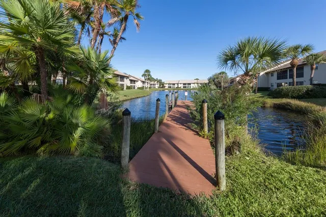 a view of a wooden deck and a lake view