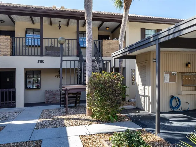 a view of house with swimming pool yard and outdoor seating