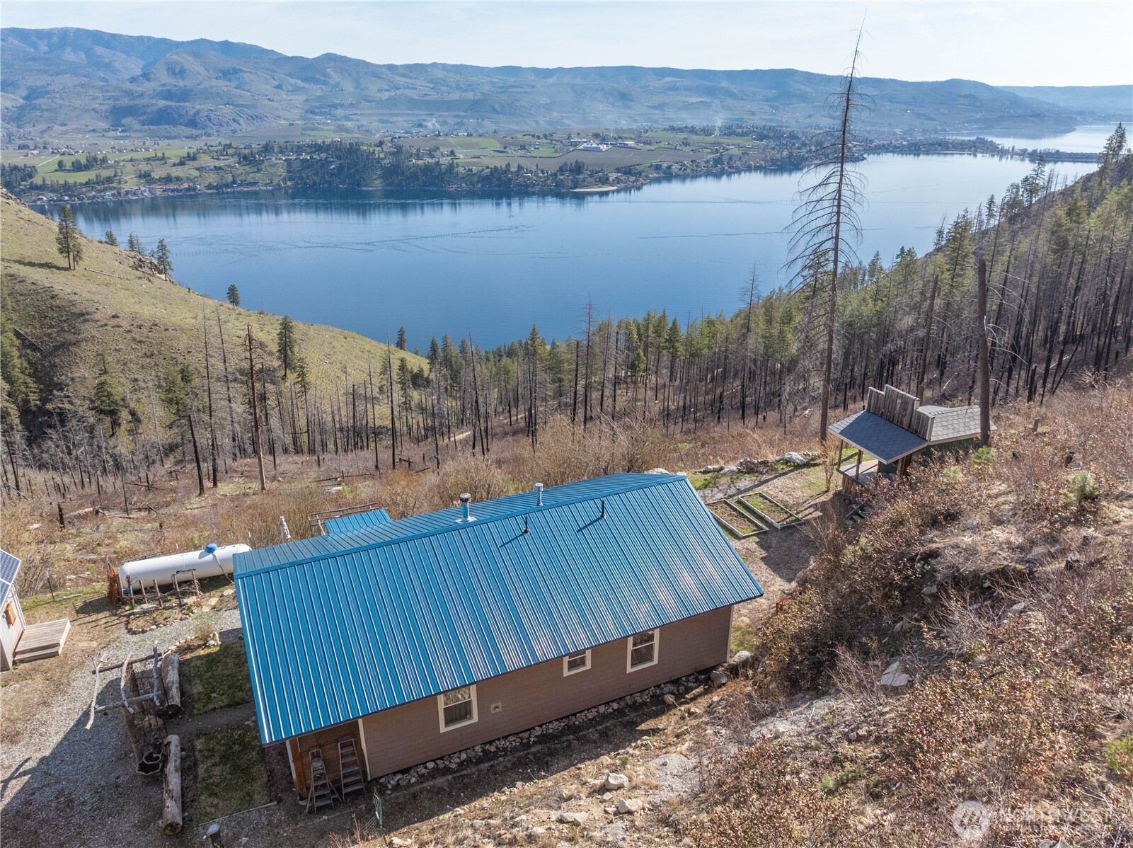 109 Granite Falls Road Chelan, WA 98816 - Photo 3 of 22 a view of a backyard with sitting area