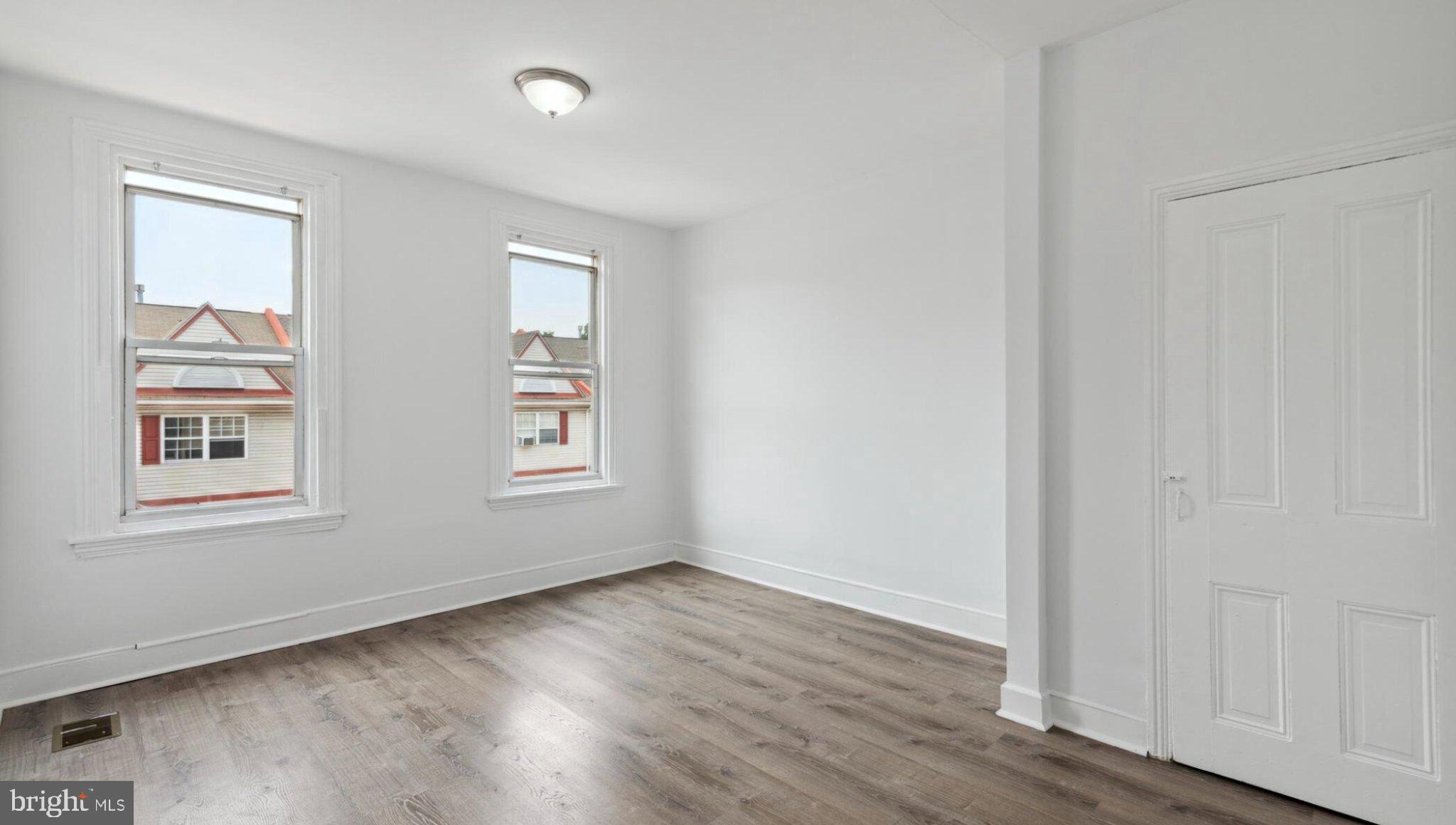 17 South 45th Street Philadelphia, PA 19104 - Photo 12 of 13 an empty room with wooden floor and windows
