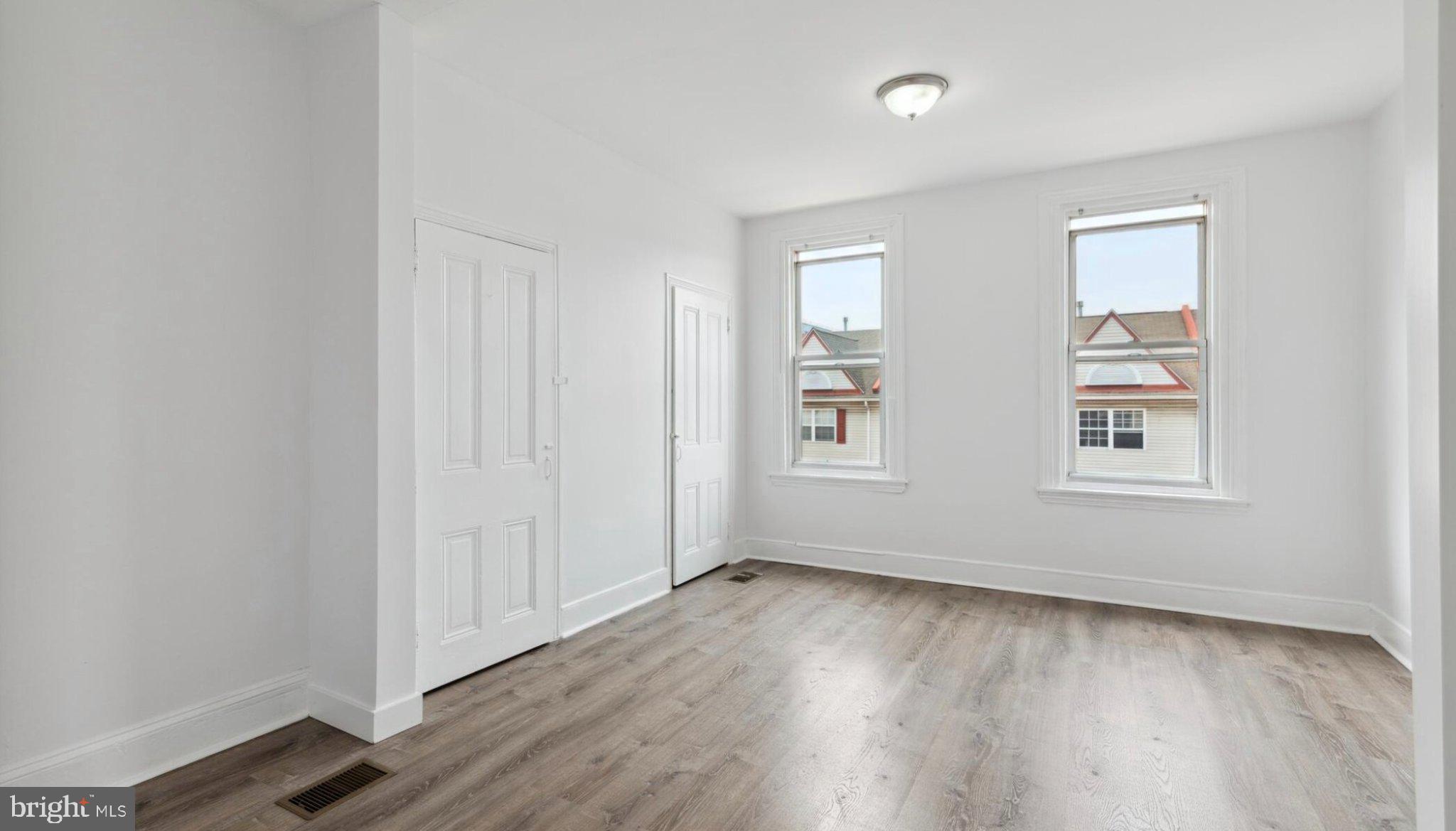 17 South 45th Street Philadelphia, PA 19104 - Photo 8 of 13 an empty room with wooden floor and windows