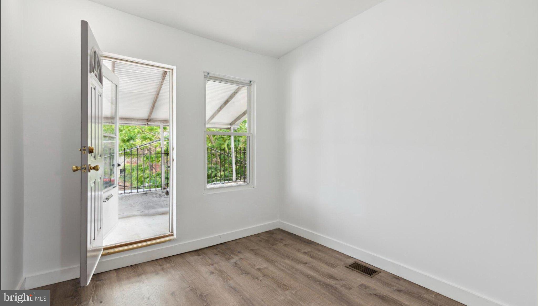 17 South 45th Street Philadelphia, PA 19104 - Photo 9 of 13 an empty room with wooden floor and windows