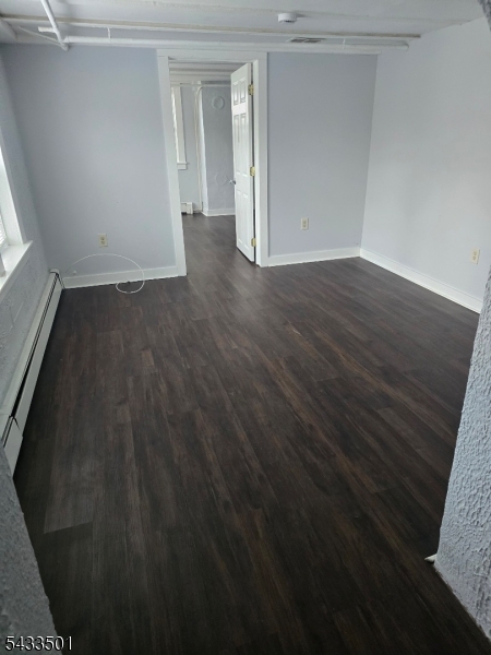 16 Musconetcong River Road, Unit 2 Hampton, NJ 08827 - Photo 7 of 12 en empty room with wooden floor