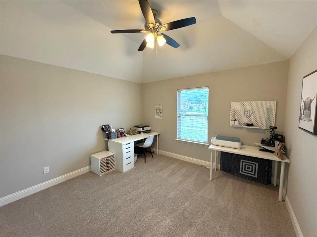 1455 Radecke Road Krum, TX 76249 - Photo 13 of 18 a view of a workspace with furniture and a window
