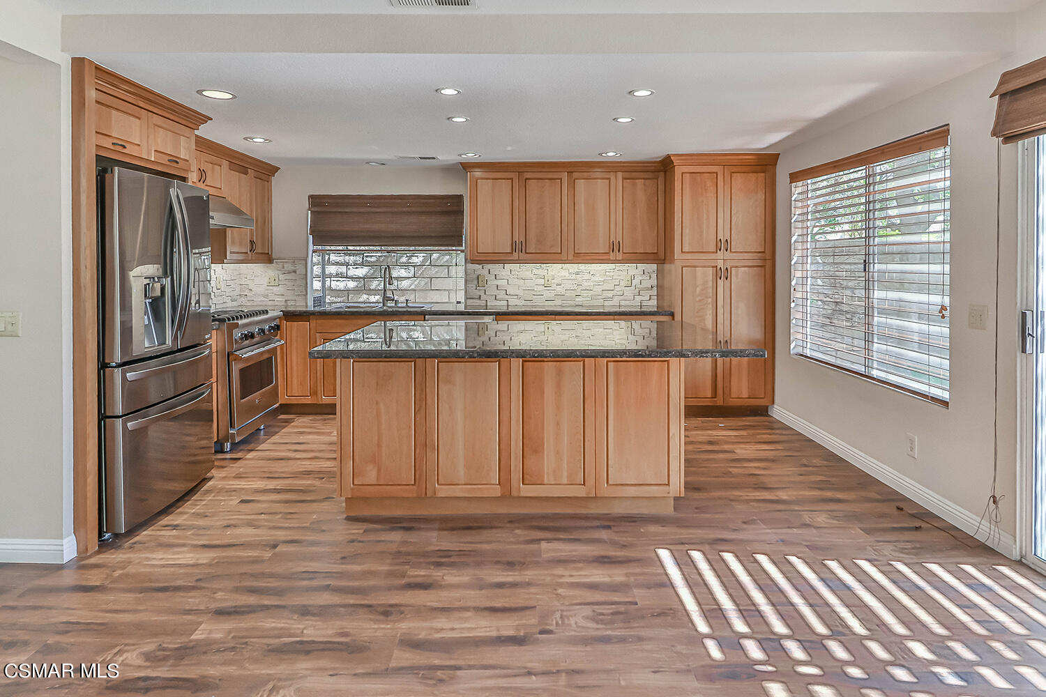 556 Fairfield Road Simi Valley, CA 93065 - Photo 14 of 49 a kitchen with stainless steel appliances granite countertop a refrigerator sink and cabinets